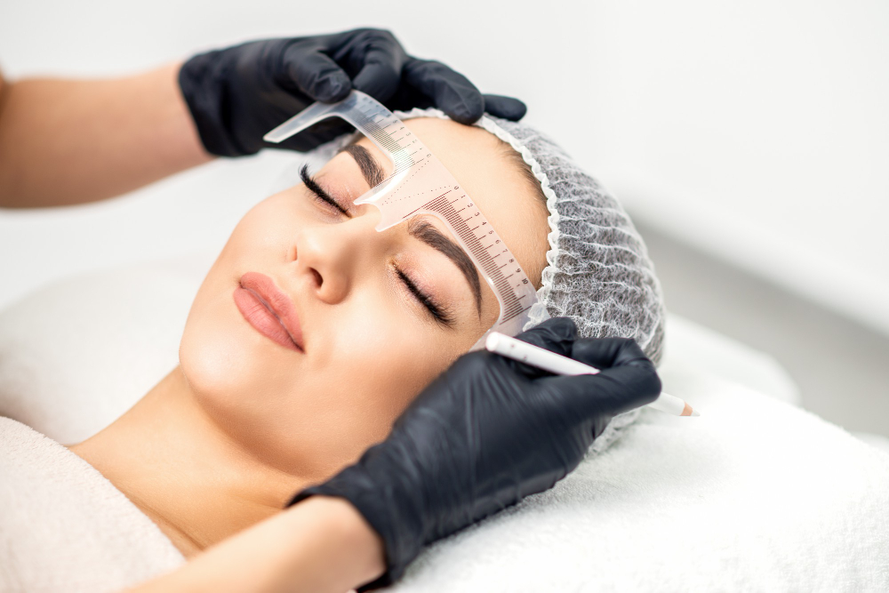 beautician-is-measuring-brows-with-ruler-before-tattooing-eyebrows